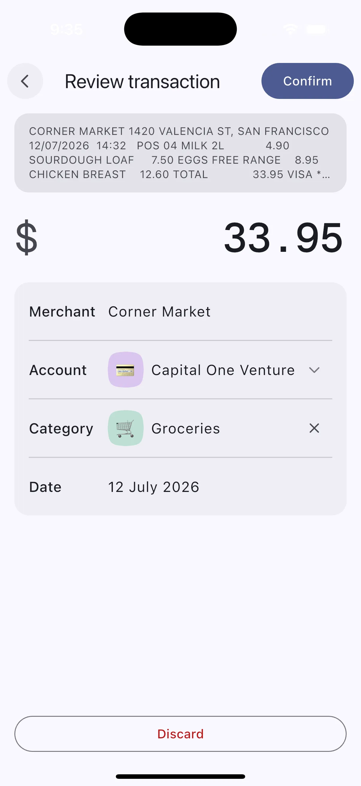 Review transaction screen showing the text read from a receipt above an editable draft: merchant Corner Market, amount 33.95, account, category and date, with Confirm and Discard actions.